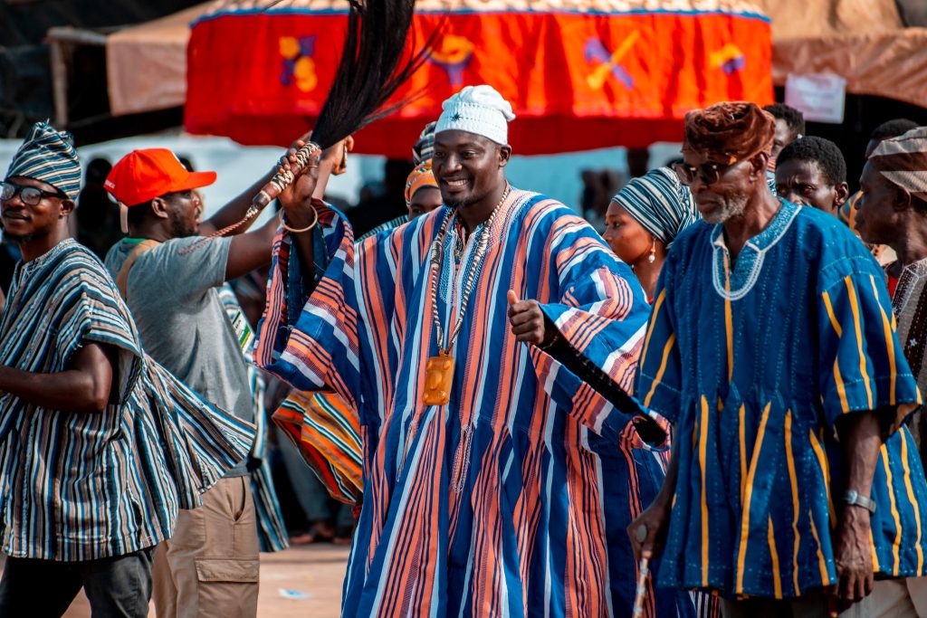 a dancer with a horse tail whisk Your Ultimate Tourist Guide to Damba Festival 2023 in Ghana 3 - Dagbon Kingdom: Your Gateway to the Best of Culture, History & Tourism